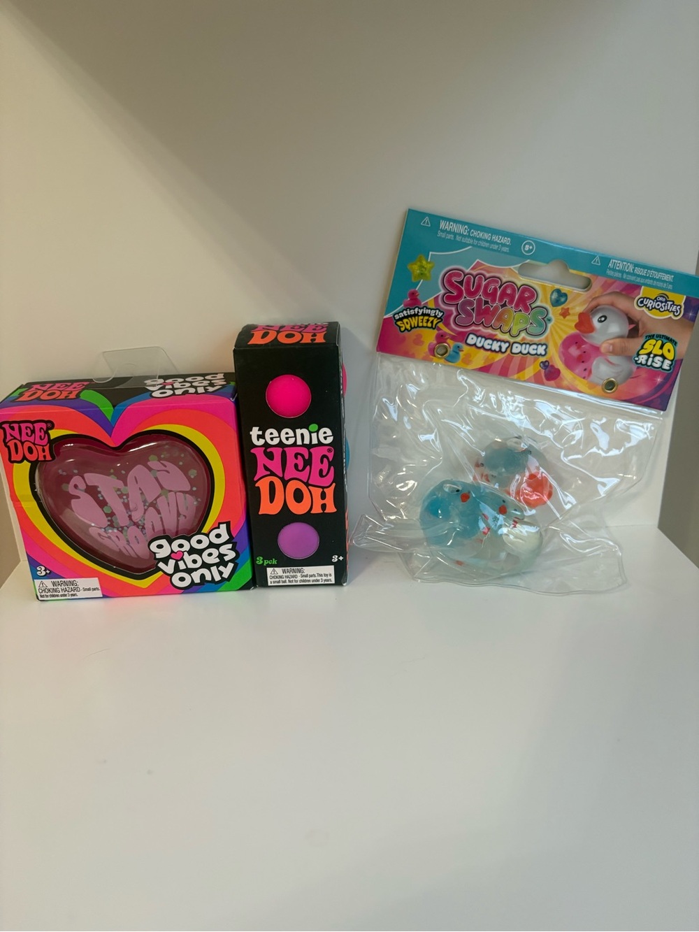 Teenie NeeDoh 3 pack, Good Vibes O& Sugar Swaps Ducky Duck viral squish - Blue.
